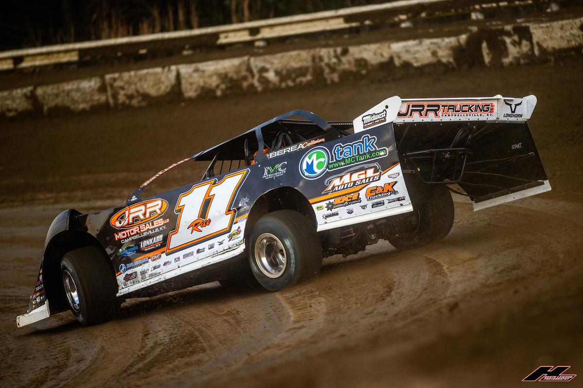 A Super Late Model digs into the corner on a heavy Batesville-style dirt track