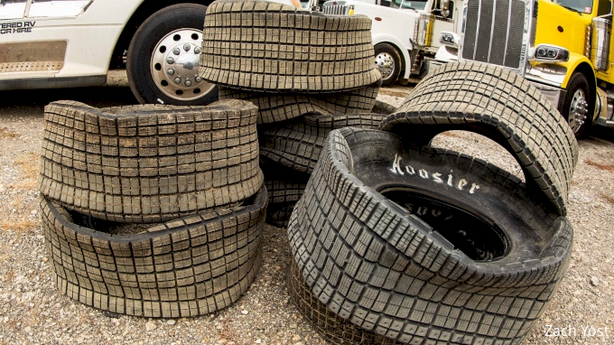 A stack of worn Hoosier tires — the story of a chewed-up dirt track surface